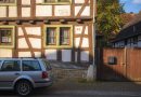 A car is parked in front of a building