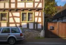 A car is parked in front of a building