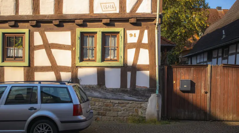 A car is parked in front of a building