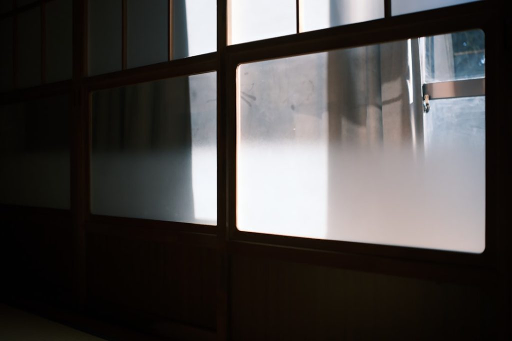 Frosted glass windows with dark wooden frames