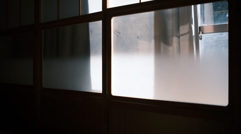 Frosted glass windows with dark wooden frames